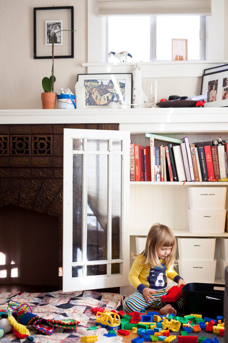 girl playing with duplo blocks