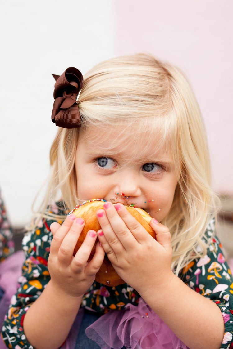 girl eating donut