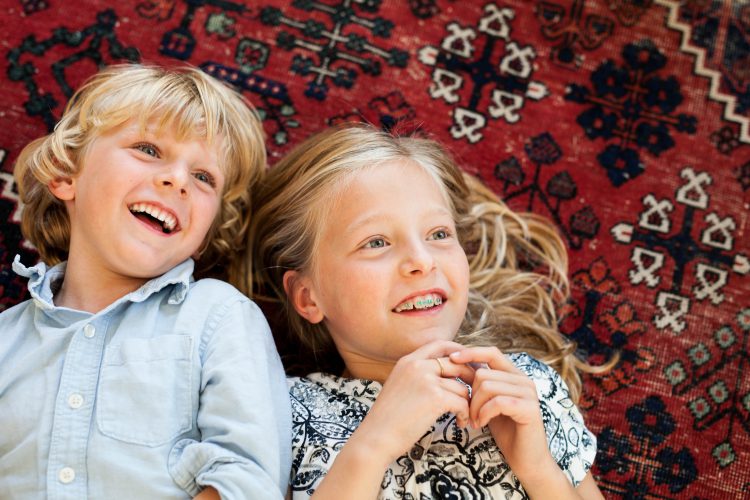 brother and sister on the floor