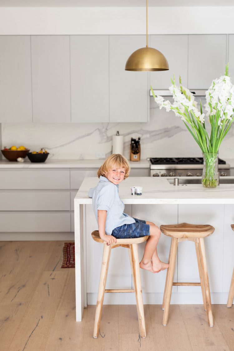 boy in a modern white kitchen