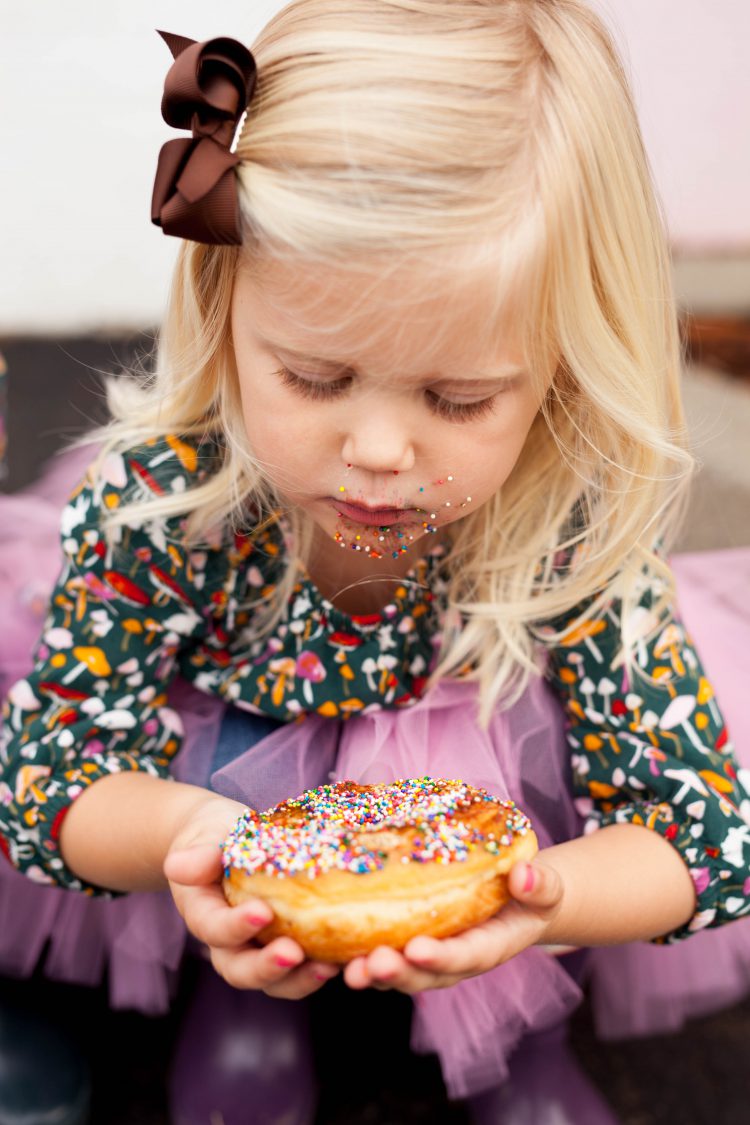 girl eating donut